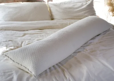 Body pillow store on bed